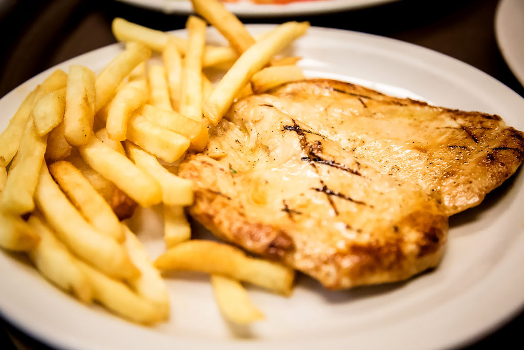 Grilled Breast of Chicken Served with French Fries or Rice and Refried Beans. OLE Flaco's.