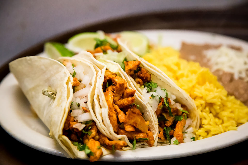 Tacos al Pastor are 3 Marinated Pork and Pinnapple Corn Tortilla Tacos, served with Rice and Refried Beans. Make substitutes below. OLE Flaco's. Mexican Restaurant of Naples