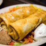 Two Deep Flour Tortillas Stuffed with a Generous Variety of Vegetables, Green Beans, Green Peppers, Onions, and Mushrooms, Served with Guacamole, Sour Cream, Rice and Refried Beans-Delicious Vegetarian Mexican Food