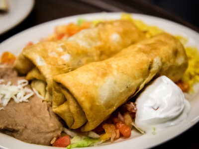 Two Deep Flour Tortillas Stuffed with a Generous Variety of Vegetables, Green Beans, Green Peppers, Onions, and Mushrooms, Served with Guacamole, Sour Cream, Rice and Refried Beans-Delicious Vegetarian Mexican Food