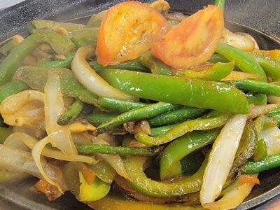 Fajitas Vegetarianas (Vegetarian Fajitas) is a Generous Portion of Fresh Sautéed Vegetables, Green Beans, Green Peppers, Onions, Mushrooms, Served Sizzling with Flour Tortillas, Guacamole, Sour Cream, Rice and Refried Beans. Add more below, OLE Flaco's of southwest florida! Choose the cook
