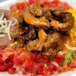 › Juicy Marinated Steak Sautéed in Chef Luis’ Spicy Chipotle Pepper Sauce, with Rice and Refried Beans. Mexican Restaurant with the best House made Chipotle Sauce