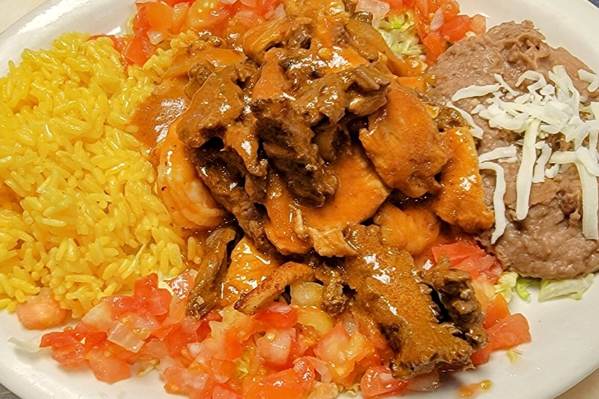 › Juicy Marinated Steak, shrimp, and chicken. Sautéed in Chef Luis’ Spicy Chipotle Pepper Sauce, with Rice and Refried Beans. Served at Flacos Mexican Restaurant of Southwest Florida