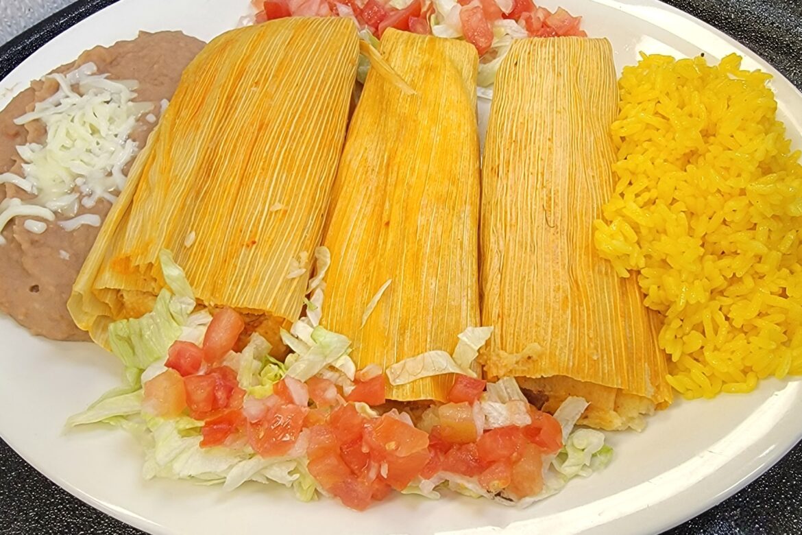 Three House Made Pork Tamales, Served with Guacamole, Sour Cream, Rice and Refried Beans