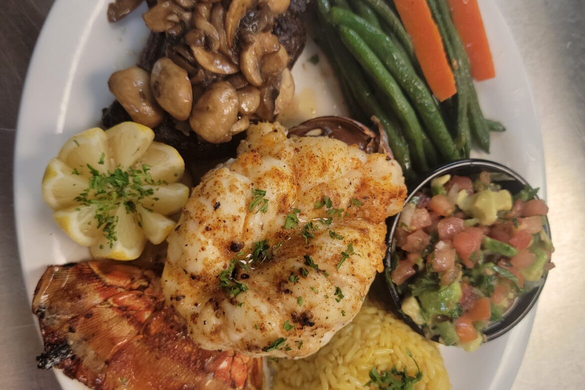 Flaco’s Surf and Turf › 12 Oz Gulf Lobster Tail and 8 Oz Filet Mignon, Cooked to Perfection. Choice of Rice or Baked Potato- Served with Sautéed Green Beans and Carrots, drawn butter, and a side of Pico de Gallo.