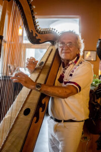 choo cho and his harp at flacos mexican restaurant located at 2371 Vanderbilt beach rd in Naples Florida